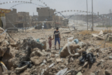 Brother and Sister Walk in War-torn Mosul, Iraq.
 
Click to enter image viewer

Use the Save buttons below to save any of the available image sizes to your computer.
