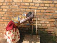 Girl drinking water in Rwanda (from Partners in Health initiative). 