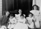 African American Children Posed for Portrait on a Porch. 